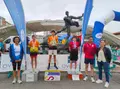 Rodrigo de la Fuente y Yon Sánchez, en el podio del Campeonato de España de Láser Run 