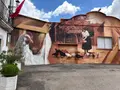 Mural de una mujer dando de comer a las gallinas en Cipérez, obra del artista salmantino Daniel Martín. Imagen Salamanca24horas