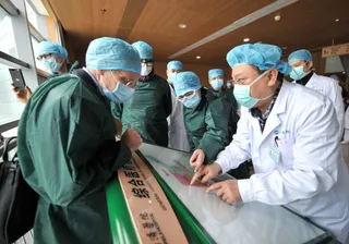 Expertos de la OMS en China. | FOTO: EUROPA PRESS